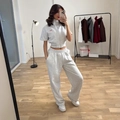 Women's grey sporty two-piece set featuring short-zip hoodie and high-waist joggers - S / Gray