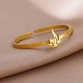 Detailed macro view of a gold-plated stainless steel ring featuring a 3D flame design element - Gold Flame