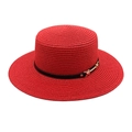 Detail view of a red woven straw boater hat with black ribbon and gold metal buckle - Red