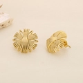Macro shot of geometric gold flower stud earrings with a textured grainy finish - Gold Radial Flower Style (KE116348-KFC)