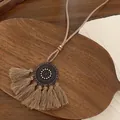 Macro detail of bohemian flower pendant with soft beige cotton tassels and wood beads - Light Coffee Round Tassel Style (2# Necklace)