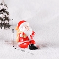 Miniature Santa Claus figurine holding yellow gift bag, Christmas ornament, 4cm height - Santa Claus No. 11