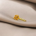 Macro shot of a gold flower non-pierced nose ring with intricate micro-pave craftsmanship - Gold Little Flower (E3616-3)