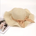 Close-up of straw sun hat with camel bow ribbon and elegant pearl decorations - Adult 56-58cm / Beige
