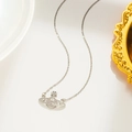 Macro detail of silver Saturn pendant necklace with sparkling inlaid rhinestones - Saturn Style (8823) / Silver