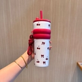 White stainless steel tumbler with cherry and bow patterns and red silicone lid - UV Printed Red