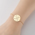 Gold compass pendant bracelet featuring engraved N E S W direction letters on delicate chain - 364-Cross Arrow Compass