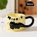 Cute ceramic black cat relief mug in cream yellow with 380ml capacity and tail handle - Milky Yellow