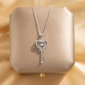 Silver heart key necklace with sparkling stones on champagne silk background - Heart Key Necklace / Silver