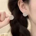Detailed view of elegant round crystal bead earrings with jade texture on earlobe - 12# Silver Pin-Pink