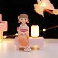 Japanese style girl figurine in pink kimono sitting on bench with luminous lantern - Orange Mini Light (1136-6)
