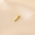 Macro shot of gold vertical bar pendant with four round white zircons on silk - Gold Rhinestone Letter-I