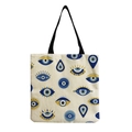 Detailed view of evil eye pattern print on large canvas tote bag with black handles - Exotic Fashion Eyes (hm2721)