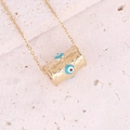 Detailed shot of gold cylinder pendant with evil eye patterns on textured stone surface - Metallic Rhombus Texture Evil Eye Cylinder Style (11#)