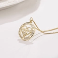Detail of gold MAMA heart pendant necklace with shimmering sunflower crystal border - Round Heart MAMA Pendant