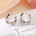 Minimalist silver twisted geometric hoop earrings displayed on a vintage paper background - Silver-Twisted Style (45249)