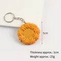 Realistic orange PVC cookie keychain with floral pattern texture and metal ring - Flower Round Cookie Keychain