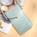 Mint blue crossbody phone wallet featuring a golden heart buckle and faux leather finish - Light Blue