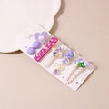 Detail of five sweet hair clips with heart and flower motifs on a display card - C Style-Purple Collection