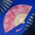 Pink folding fan with bamboo frame featuring floral and butterfly motifs and tassel - Pink Floral Butterfly