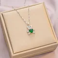 Teddy bear necklace with green heart gemstone and white crystals on a jewelry box - 6053 Green Heart Bear / Silver