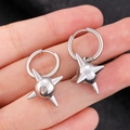 Close-up of punk style silver spiked ball earrings with metallic finish for men and women - White K Smooth Buckle Spiky Ball (DZ-257)