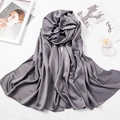Gray silk scarf elegantly folded next to Kinfolk magazine and perfume on a white surface - 180*70cm / Dark Gray