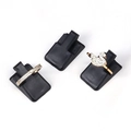 Elegant gold swan ring and diamond band set displayed on black jewelry stands - Black