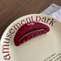 Detailed top view of large dark red acetate hair claw clip with France Handmade gold stamp - Oval