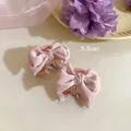Lot de deux pinces à cheveux à nœuds en satin rose clair pour coiffure de princesse - 1 Pièce / Rose