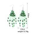 Detailed view of neon green skull hand earrings with size markings 9.8cm by 3.9cm - Resin Skeleton Hand 2 Green