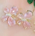 Elegant gold butterfly earrings featuring vibrant pink gemstones and white zircons - Gold Plated Pink Stone