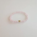 Pink beaded gemstone bracelet with a 3D gold heart pendant in a minimalist design - Rose Quartz Bracelet 6MM