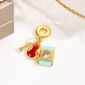 Detailed view of gold camera bead charm with blue and red enamel and a clear crystal gem - Photography - Blue Red Camera (ZYN-DME896G-2)