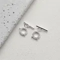 Macro shot of silver 14K gold plated OT toggle clasp with micro-pave cubic zirconia - Style K Luxury Full Zirconia / Silver