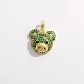 Golden bear head pendant encrusted with green zircons and black stone eyes on light background - Gold Green Zirconia