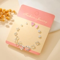 Titanium steel heart and flower earring set with pink enamel on a fashion display card - Silver Pink Heart Flower (E1932-1)