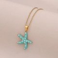 Blue starfish pendant necklace with white dots on a gold stainless steel chain - Lake Blue Dotted Starfish