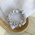 Silver grey satin scrunchie with a glossy silk finish and pleated design for ponytails - Light Gray