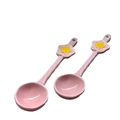 Close-up of pink ceramic spoons with yellow star handles for Halloween coffee mugs - One Star Spoon