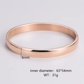 Detail view of 8mm rose gold oval bangle with precise size and weight measurements - Men's Rose Gold