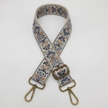 Close-up of bohemian embroidered wide shoulder strap with bronze metal buckles and pattern - Beige Grey Brown Bronze Hook