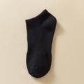 Single black cotton knit crew sock with ribbed cuff displayed on a neutral background - One Size / Ankle Sole Elastic Black