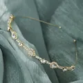 Elegant thin gold headband with sparkling round and pear-shaped rhinestones - Raindrop Rhinestone Luxury Style