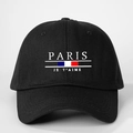 Detail showing white PARIS text and JE T'AIME embroidery on black cotton baseball cap - One Size / Black