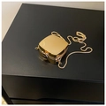Glossy gold mini hard shell bag with delicate snake chain strap for evening wear - Square