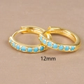 Macro detail of 12mm golden hoop earrings with turquoise beads on tan background - 12mm / Gold (Blue Zircon)