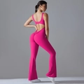 Detail of rose pink open back yoga jumpsuit featuring ruched butt lift and flared leggings - Dragon Fruit