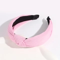 Stylish pink ribbed knit knotted headband with black lining and wide cross design - Pink