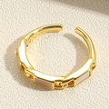 Detail of an 18K gold plated open ring with rectangular light pink shell inlays - JZ0317-2 Shell Open Ring / Shell